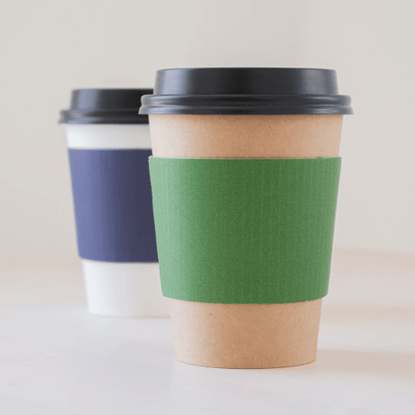 Wholesale kraft coffee cup sleeves on hot paper cups, insulated for a comfortable grip
