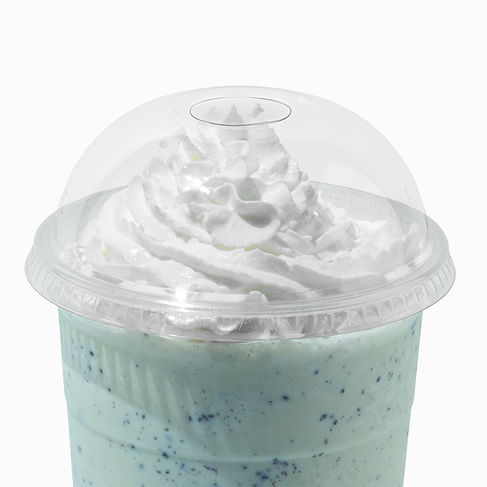 Clear 107mm dome lid on a 32 oz cold drink cup